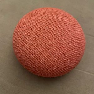 An orange mini nest google home series 2. Bought new, Used once.